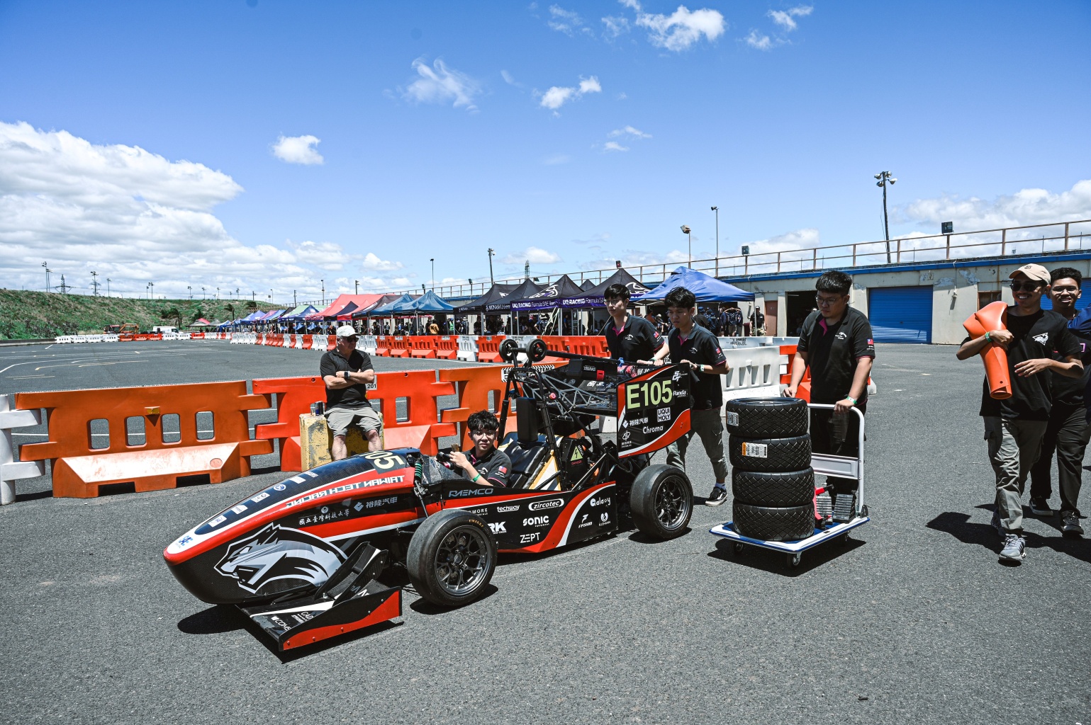 NTUST Formula Racing Team with FSAE race car and Phrozen support materials at Victoria, Australia track.